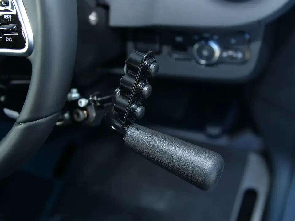 Buttons and lever on steering wheel to aid driving