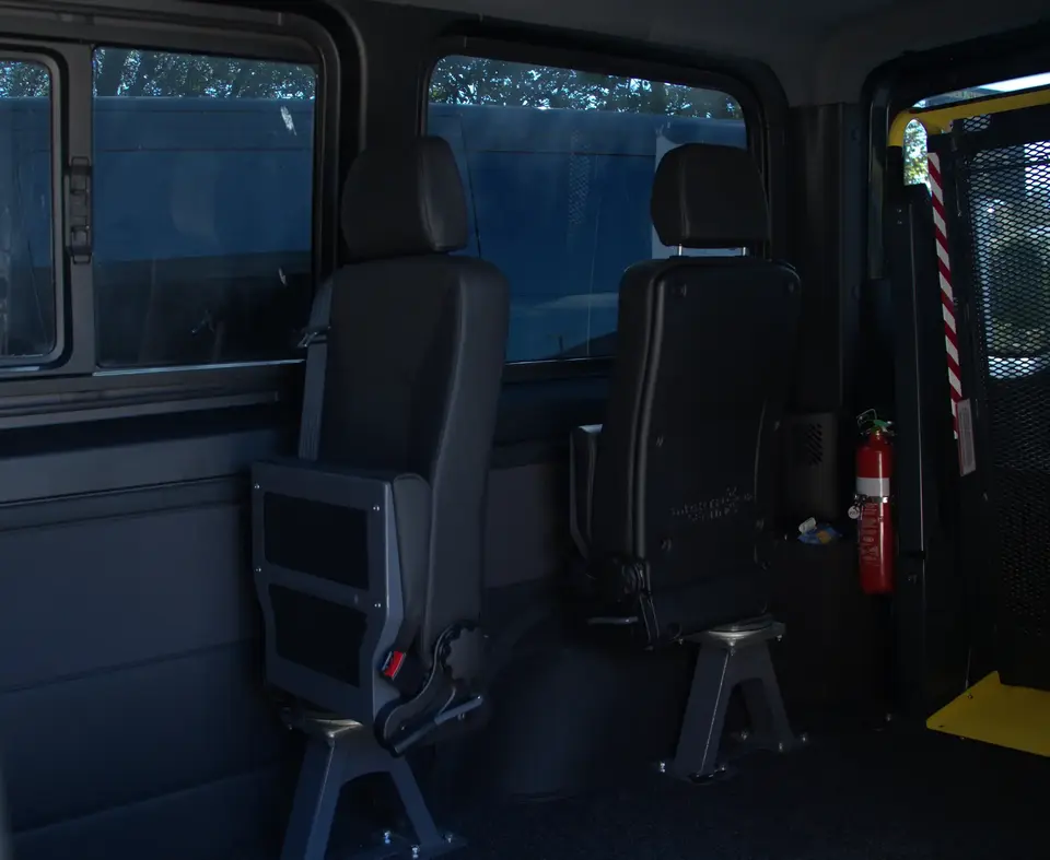 2 pivot seats in van folded, one facing side, one facing front